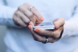 Woman holding cell phone